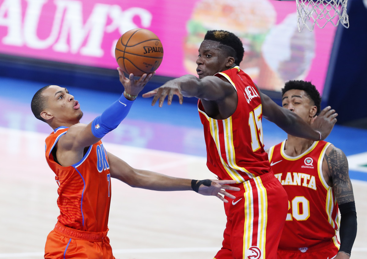 Bazley gets to the rim against Atlanta's Clint Capela as forward John Collins watches on.